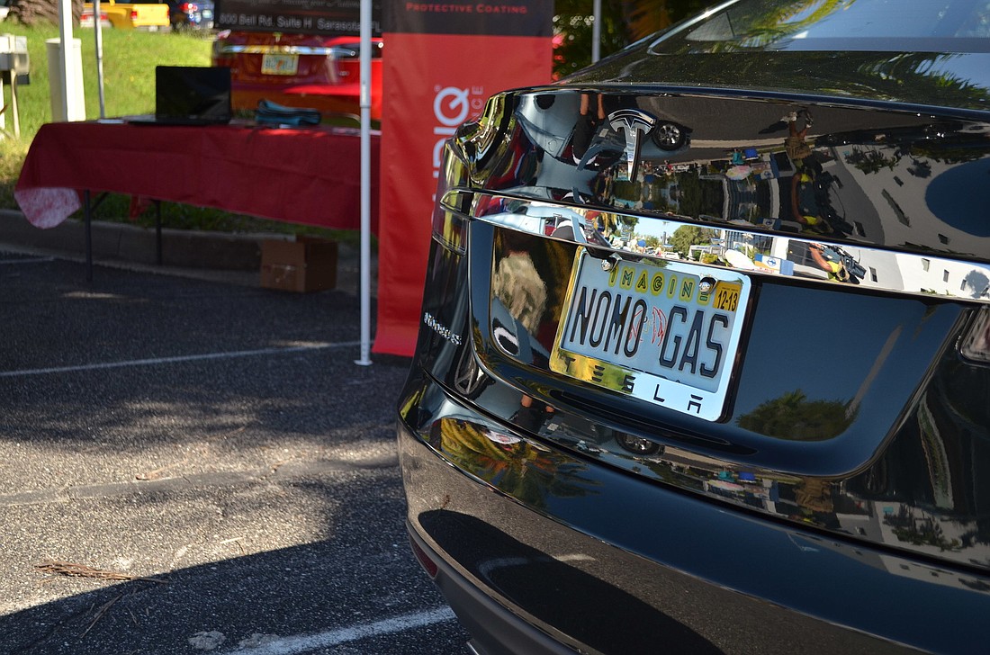 Clever license plates highlighted the National Plug in Day electric-car show Saturday, Sept. 28, at Mote Marine Laboratory.