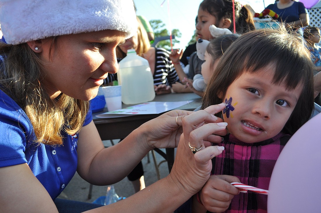 Activities offered to students and their families Dec. 18 at Party in the Park include face painting and crafts.