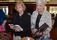 Gal pals Elizabeth Alee and Alyce Shaw browse their hand bag options.