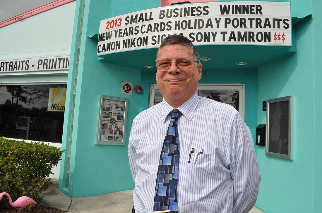 Johnson PhotoImaging General Manager Michael Arbor says the business is ready to serve customers, despite two robberies last week. The store is taking steps to improve security, while ensuring product offerings remain available to customers.