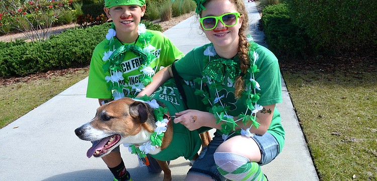 Nathan Parker, 9, and Jenna Smith, 12, say â€œcheeseâ€ with 5-year-old Jack.