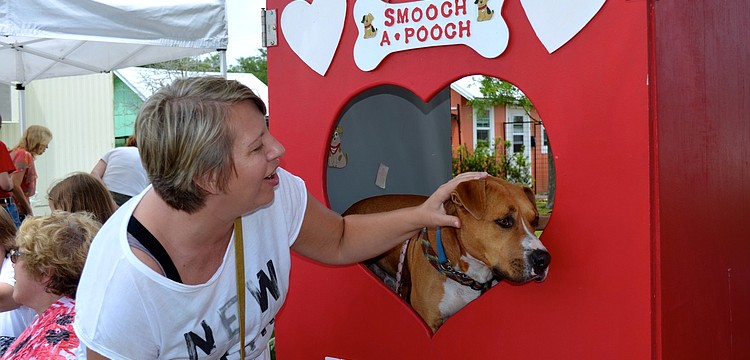 Corissa Grothe prepares to â€œsmoochâ€ Kris Kringle.