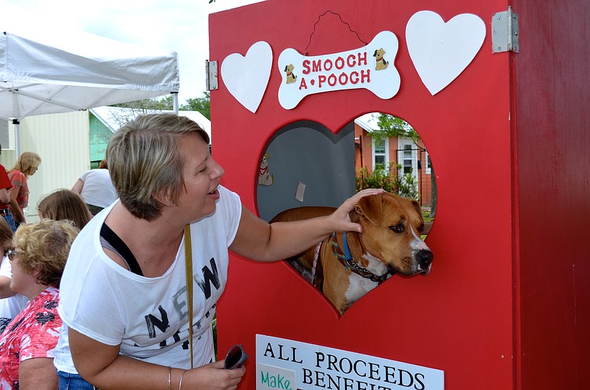 Corissa Grothe prepares to â€œsmoochâ€ Kris Kringle.