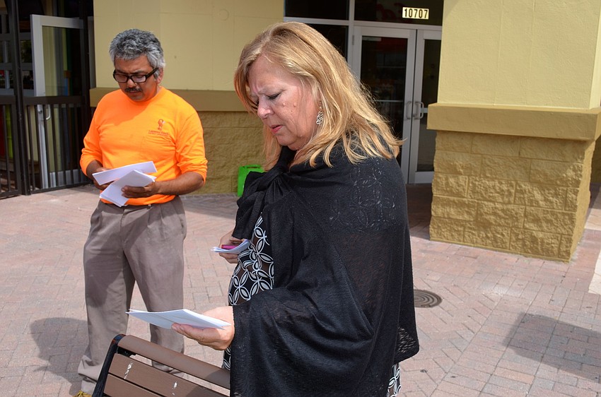 Cristi Valentine reads over a clue to determine the next stop on the hunt.