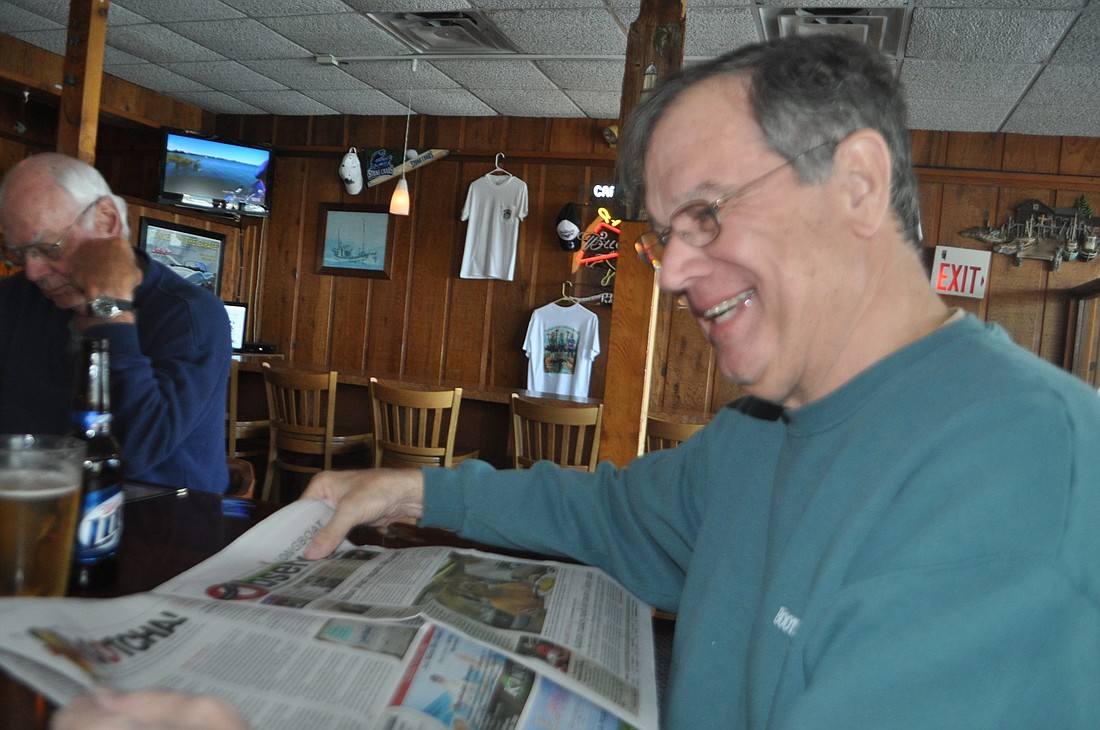 Terry Griffin, pictured at MooreÃ¢â‚¬â„¢s Stone Crab Restaurant, laughs as he realizes our annual April FoolsÃ¢â‚¬â„¢ issue fooled him.