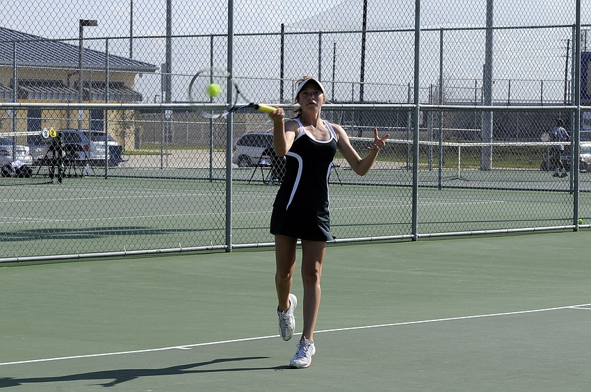Lakewood Ranchâ€™s Courtney Peong returns a serve during her No. 5 singles final April 3.