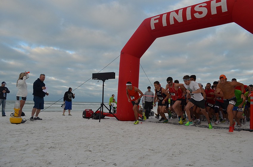 Runners take off at the blare of the horn.