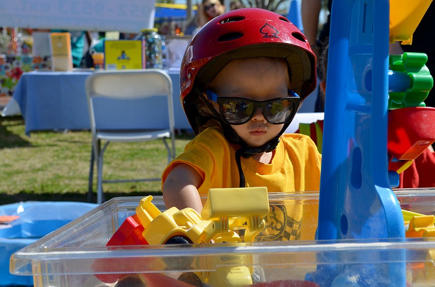Jack Johnson plays in the toy bin.