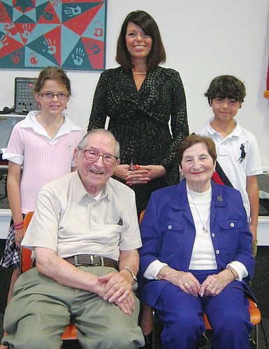 Holocaust survivors Frank and Eva Schaal (front row) were joined by Temple Emanu-El Religious School fourth-grader Julia Beatt, director of education Sabrina Silverberg and fifth-grader Joshua Cappelli following their talk.