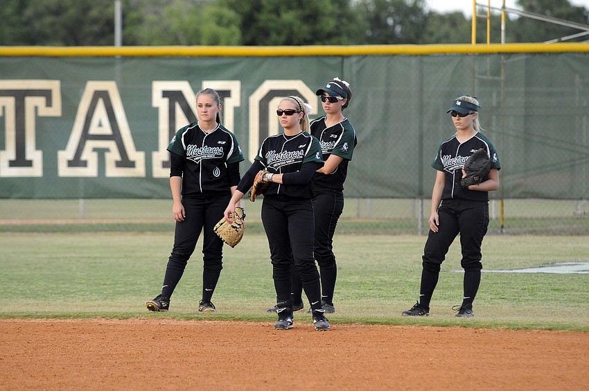 Shea Fisher, Jenn Trotter, Taylor Newton and Caitlin Brown wait for the start of their rivalry game with Braden River.