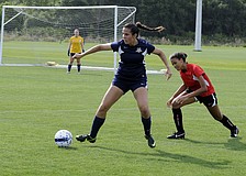 Sarasota High junior Kim Fabijanczuk regains possession for the FC Sarasota U16 team.