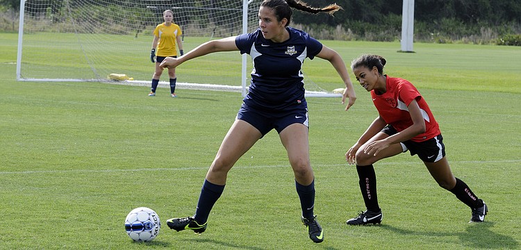 Sarasota High junior Kim Fabijanczuk regains possession for the FC Sarasota U16 team.