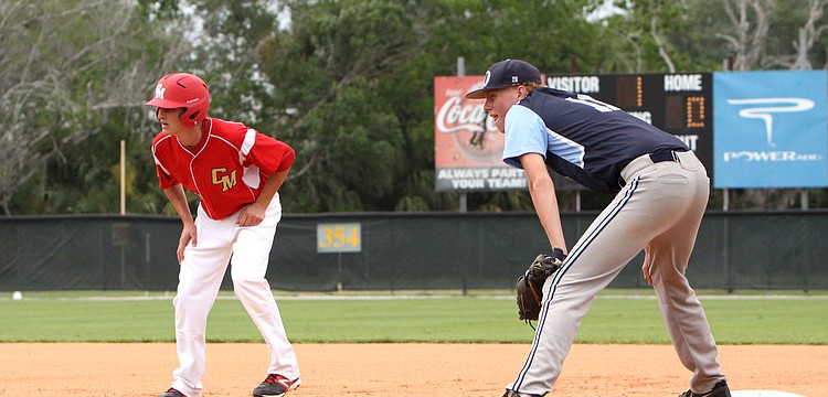 Cardinal Mooneyâ€™s Matt Quinlan, No. 16, leads off first while Out-of-Door Academyâ€™s Alex Horan, No. 11, stays close to first base.