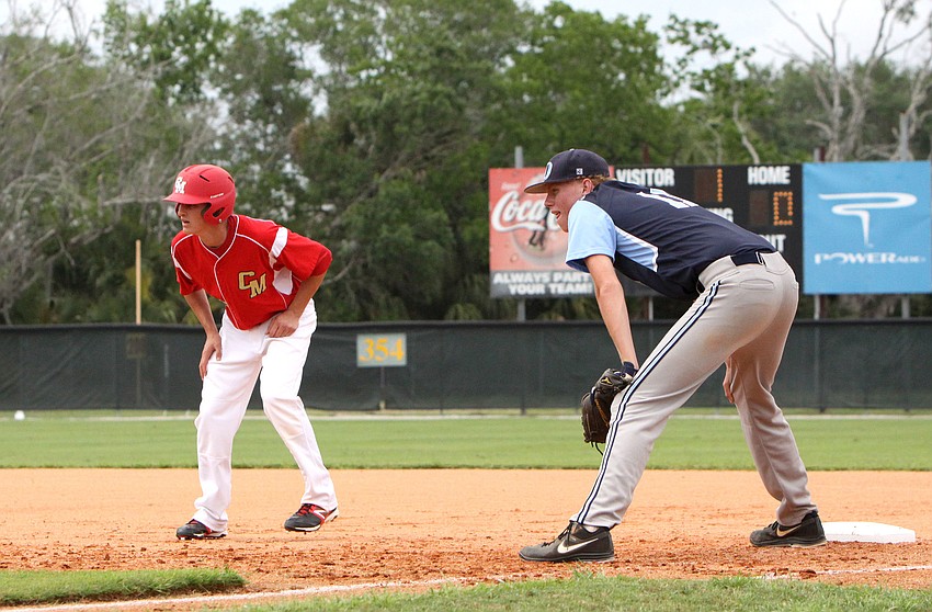 Cardinal Mooneyâ€™s Matt Quinlan, No. 16, leads off first while Out-of-Door Academyâ€™s Alex Horan, No. 11, stays close to first base.