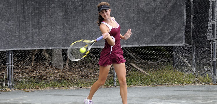 Riverview High junior Emily Schofield returns a shot in her No. 1 singles match.