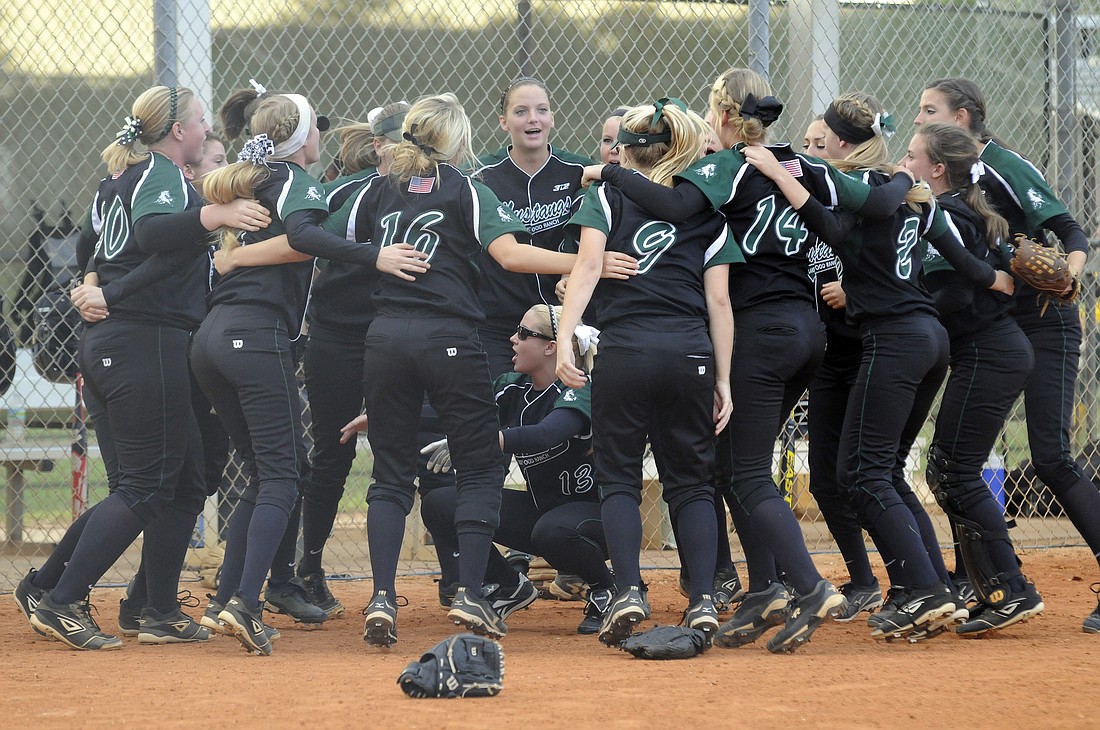 The Lakewood Ranch High softball team gets pumped up before the start of its game with rival Braden River April 9.