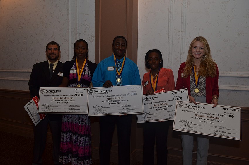 Booker High School Assistant Principal Josh Leinweber with Booker High School seniors Kayla Wilkins, Stephanie Moylan, Michael Jones and Cassandra Stephens