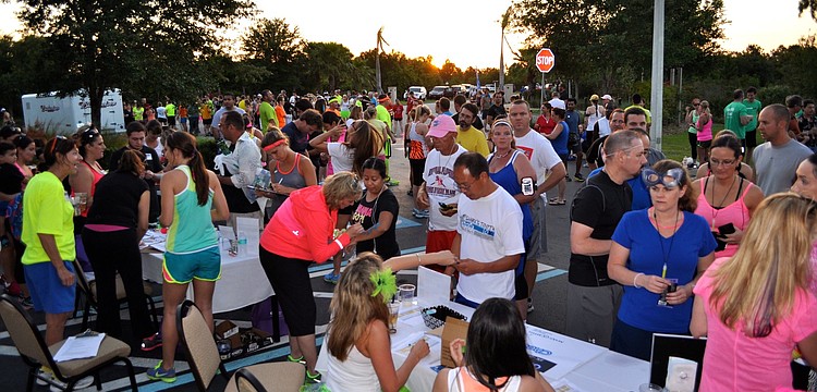 More than 400 people signed up prior to the day of the race and more than 200 more people signed up at the race to participate in the first annual Glow-Run-Wish 5K-ISH Fun Beer Run.