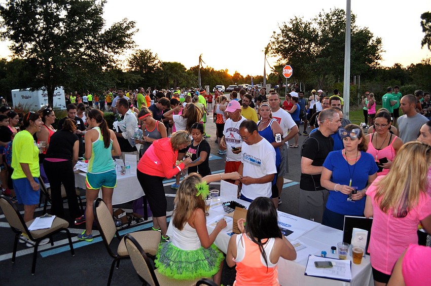 More than 400 people signed up prior to the day of the race and more than 200 more people signed up at the race to participate in the first annual Glow-Run-Wish 5K-ISH Fun Beer Run.