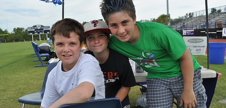 Out-of-Door sixth graders Anthony Squitieri, Max Hajduk and Ethan Marino, who sold glow sticks at the race.