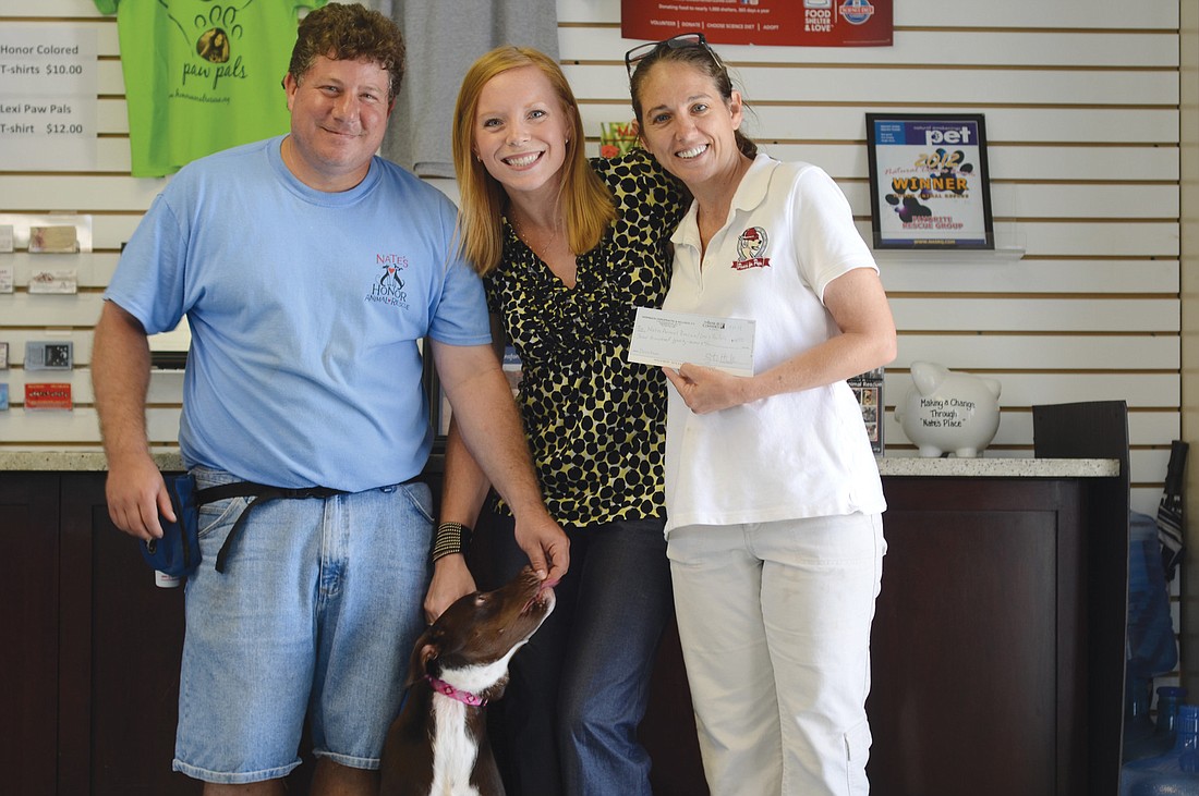 John Cortese, Dr. Heather Crawford, Dari Oglesby and Emma (an Honor Rescue dog the Crawford family adopted in February). Courtesy photo.