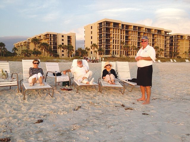 Here, Mary Ahern, Bobby Reardon, Lorraine Reardon and Paul Ahern enjoy the sunset in front of Beachplace condominium.
