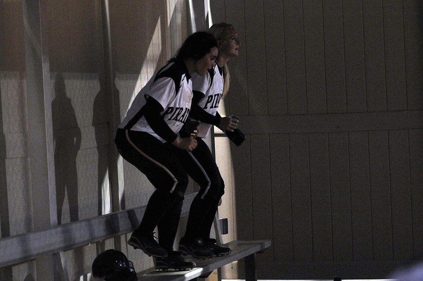 Braden River seniors Jessica Cadorette and Hannah Loyer rally their teammates during the bottom of the third inning.