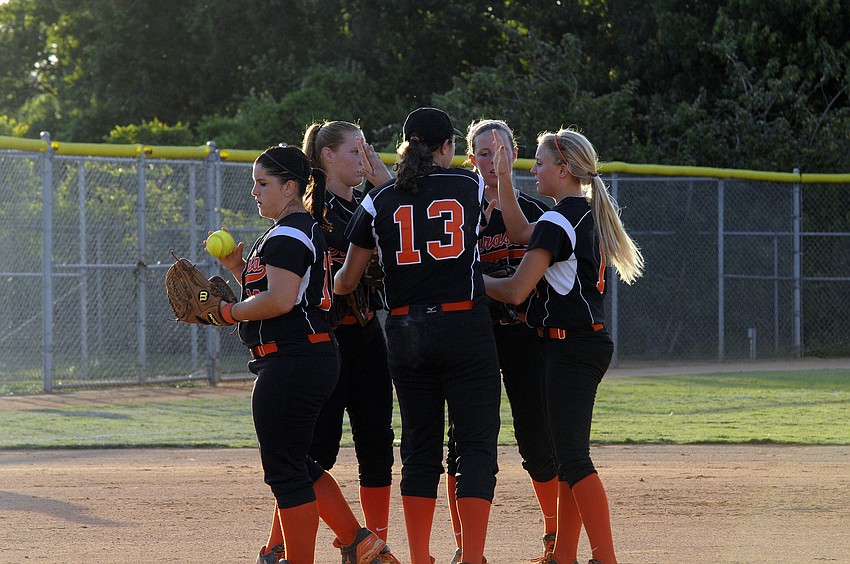 Sarasota High pitcher Clarissa Lynch and the infield celebrate following on of Lynchâ€™s two strikeouts.