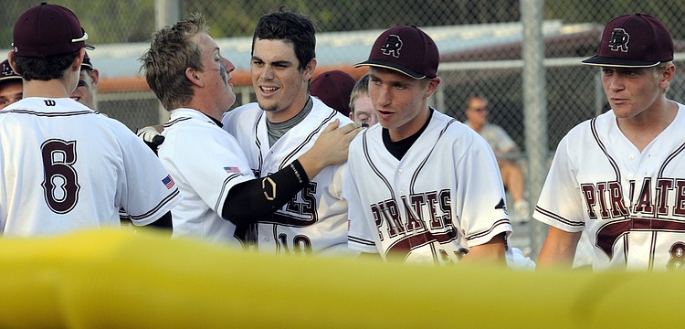 Braden River senior Dylan Lee, center, is congratulated following his solo home run in the bottom of the first inning.
