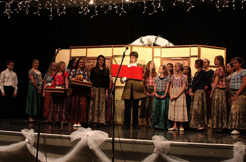 The cast reacts to the announcement made by the Herald, Jackson Helwege, that the Prince is giving a ball.