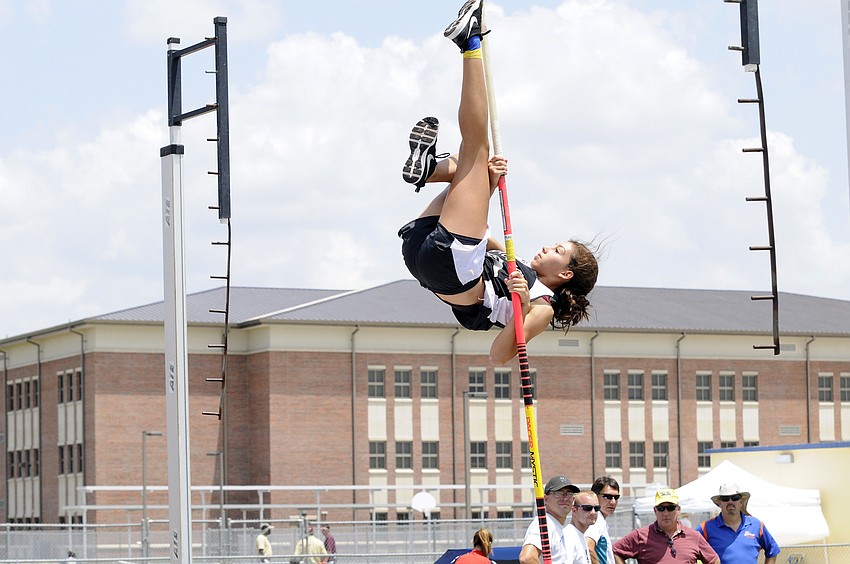 Braden River freshman Spirit Cress warms up before the start of the pole vault competition.