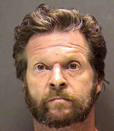 Kevin Koscielniak, 53, was arrested for burglary and beating a dog to death.