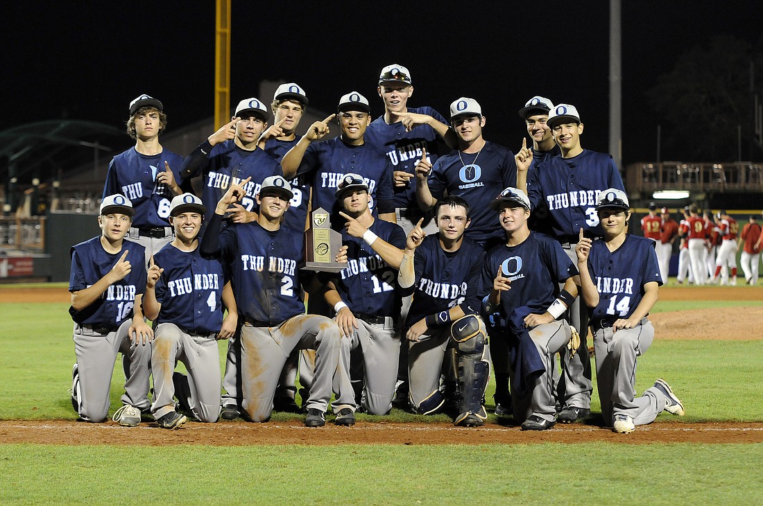 The Out-of-Door Academy baseball team celebrates its second district championship in three years after defeating Cardinal Mooney 11-3 in the Class 3A-District 10 championship April 26.
