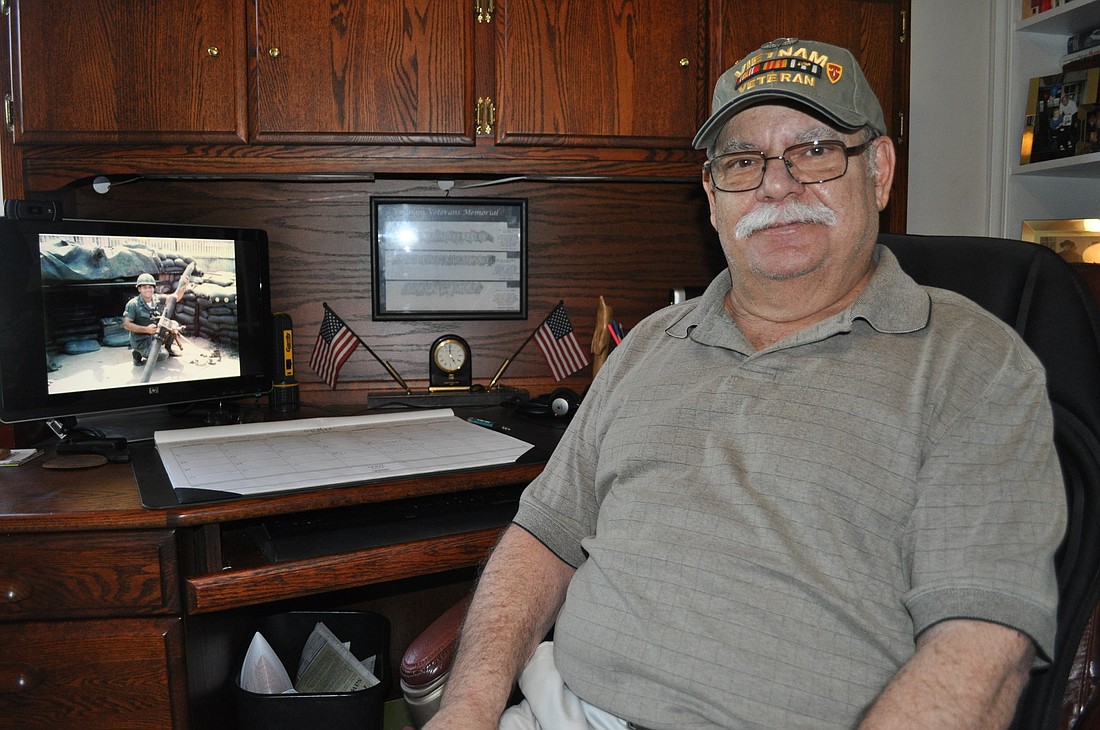 John Marino, 69, chooses not to forget his service in the Vietnam War. Reminders are everywhere, including the desktop of his computer, where a picture of his younger self at war looks back at him.