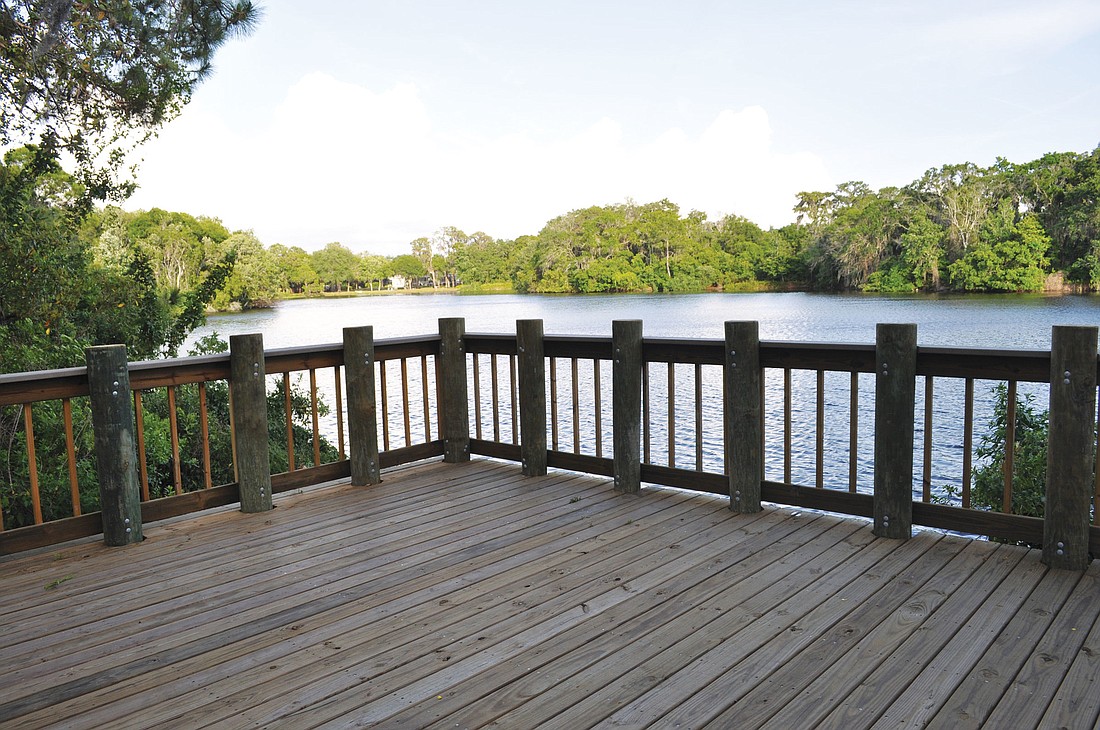 An observation deck/fishing pair overlooks a 10-acre lake with a canoe launch.