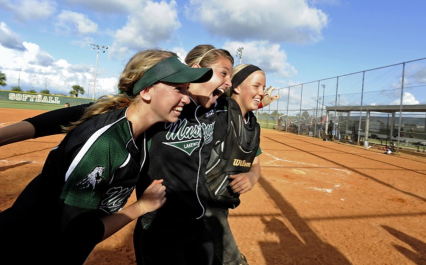 Sierra Schappacher, Jackie Schoff and Talli Sharp celebrate following Lakewood Ranchâ€™s 8-3 victory over River Ridge in the Class 6A-Region 3 finals May 3.