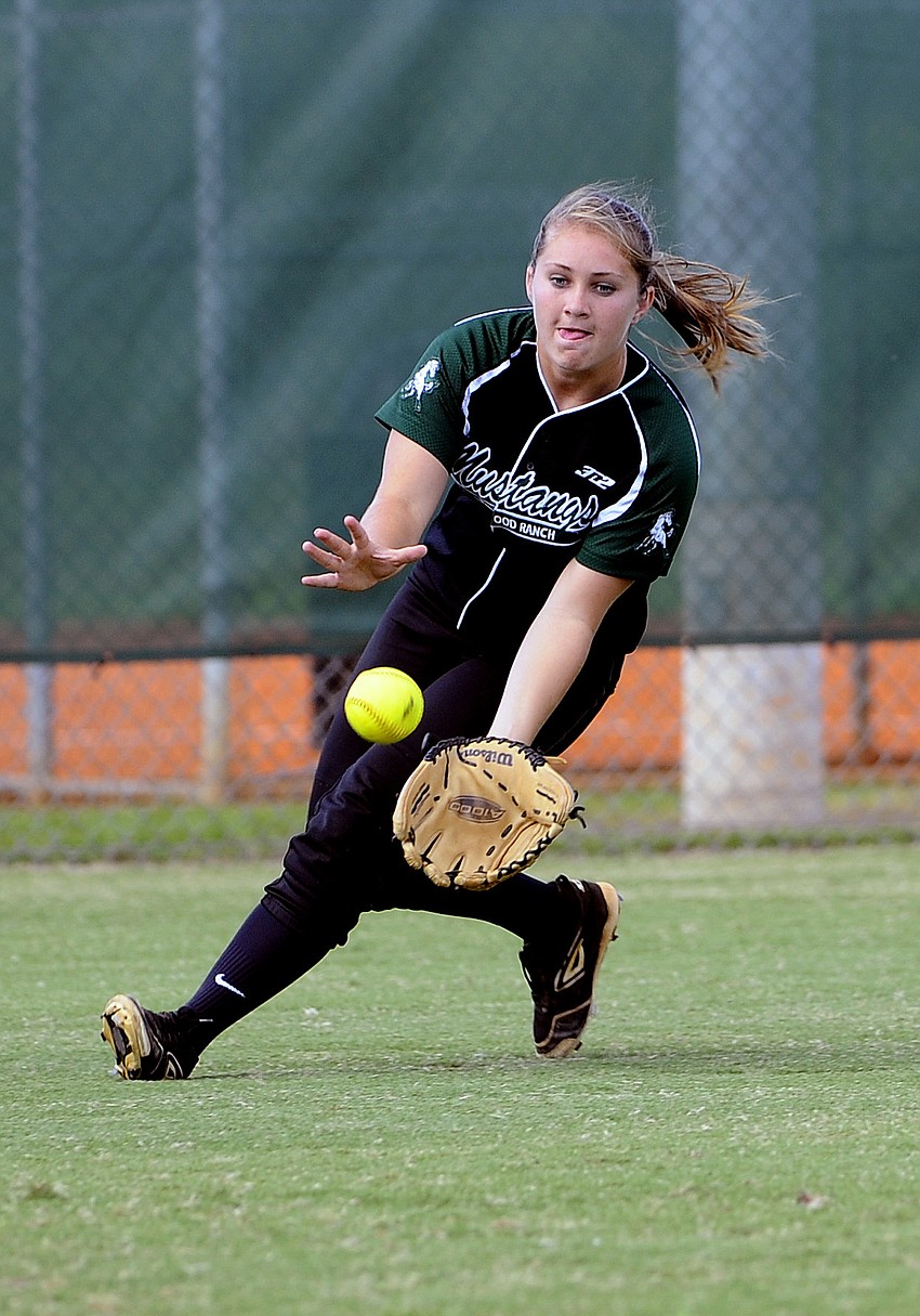 Left fielder Shea Fisher charges towards a ground ball.