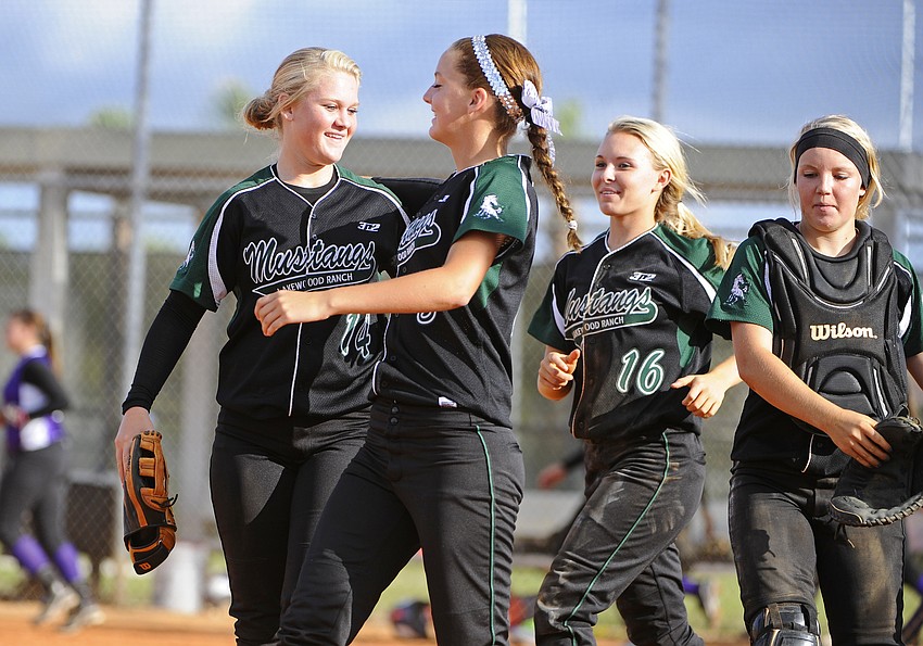 Lakewood Ranch sophomore pitcher Amanda Rak, left, is congratulated by her teammates following the Lady Mustangs regional final victory.
