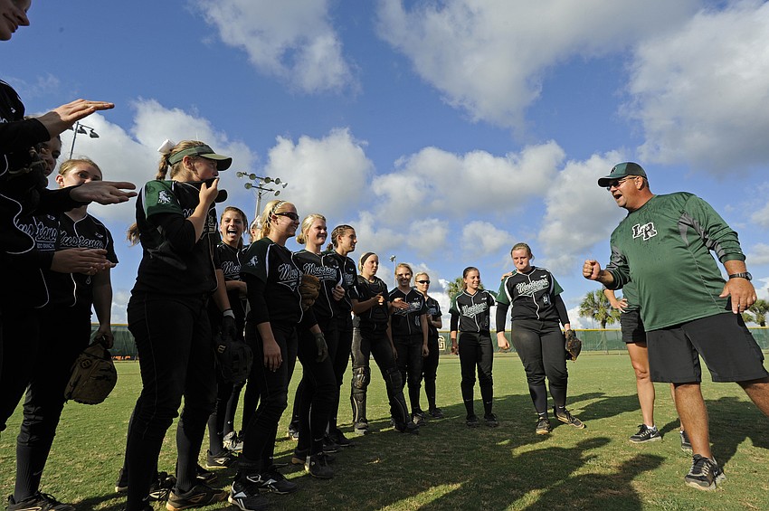 Lakewood Ranch High coach Tony Cummins rallies his team together before the start of the game.