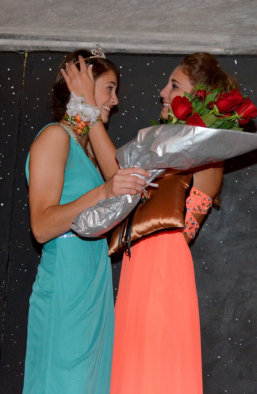 Paige Troyer crowns Nicole Wittmer queen.