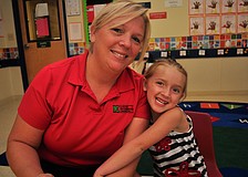 Christina and Nadia Grubbs, 4, feasted on muffins.