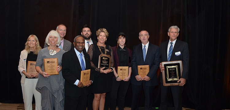 Winners gather together after being recognized for their hard work.