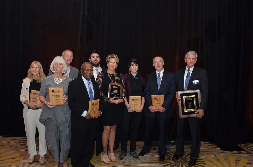 Winners gather together after being recognized for their hard work.