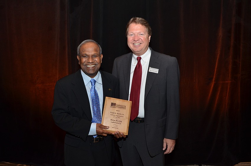 President Emeritus Dr. Kumar Mahadevan of Mote Marine Aquarium and Mike Beitzinger of IBERIABANK