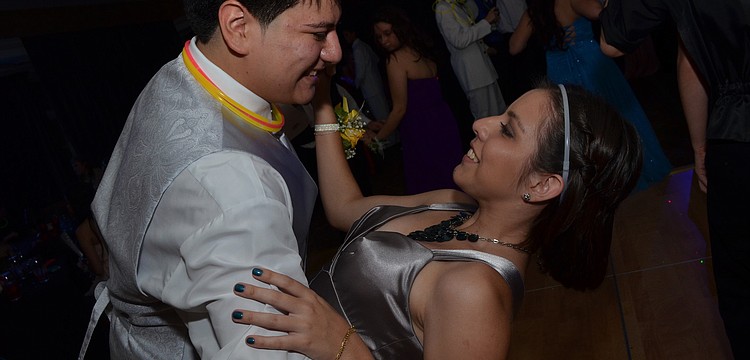 Mariano Ortiz dips his date Gabriela Landivar.