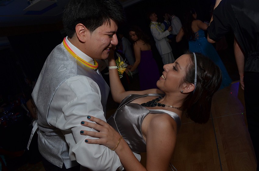 Mariano Ortiz dips his date Gabriela Landivar.