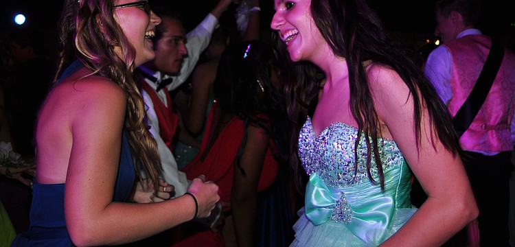 Junior Megan Harden dances with senior Alexis Brocious.