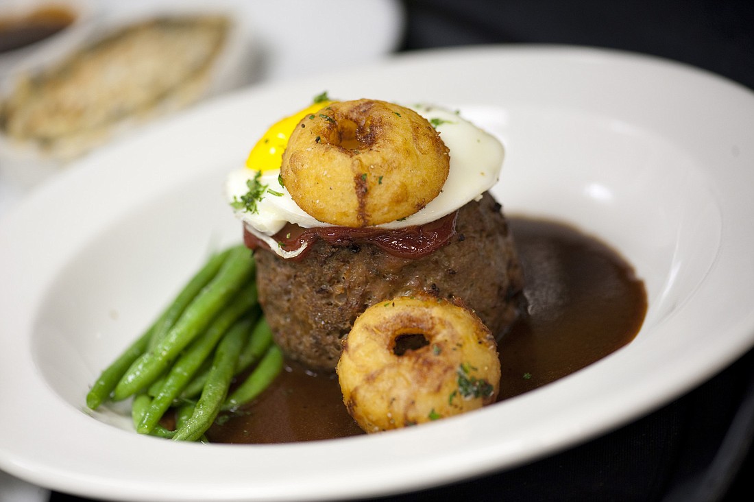 Libby's Kobe meatloaf topped with a poached egg and fried onion