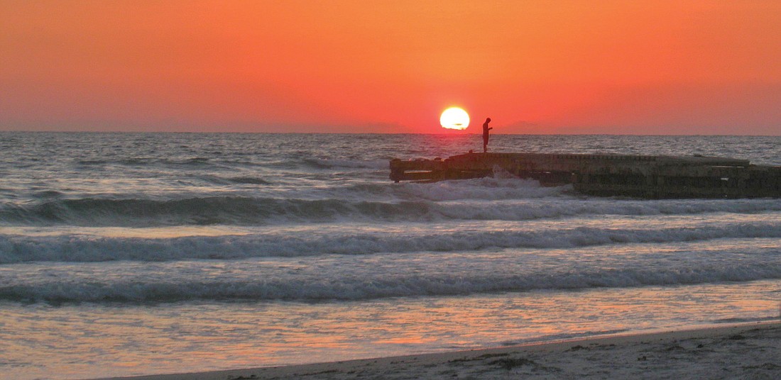 East County resident Karen Rawlings submitted this photo of a fisherman at sunset on Bradenton Beach.