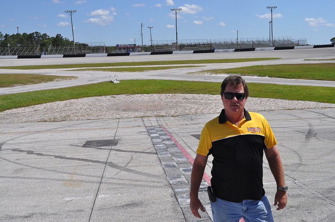 Kevin Williams, one of the new owners of Desoto Speedway, now Full Throttle Speedway, stands on the freshly renovated track, which has 18-degree banked turns primed for fast driving. The new racing season started May 4.